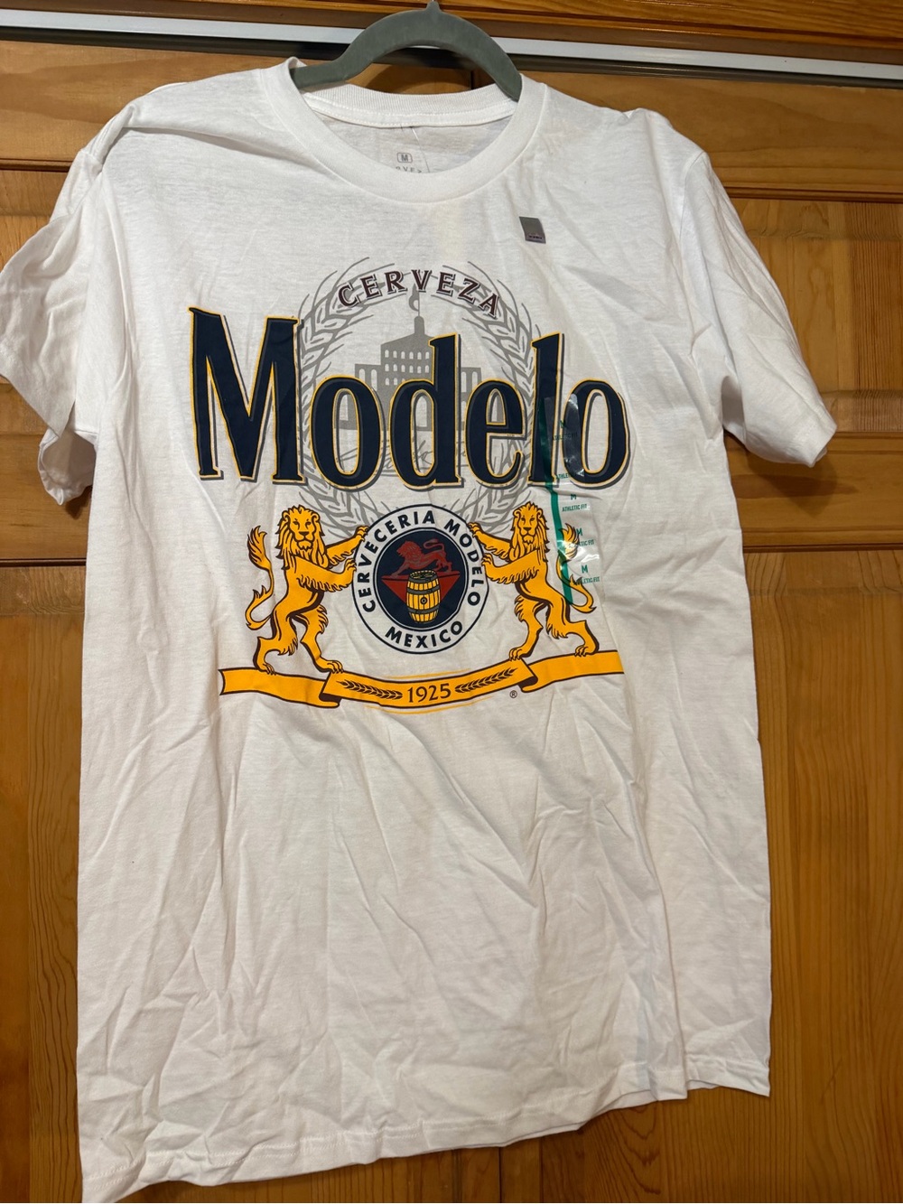 ModelCo White Short Sleeve Tee with Navy and Gold Crest
